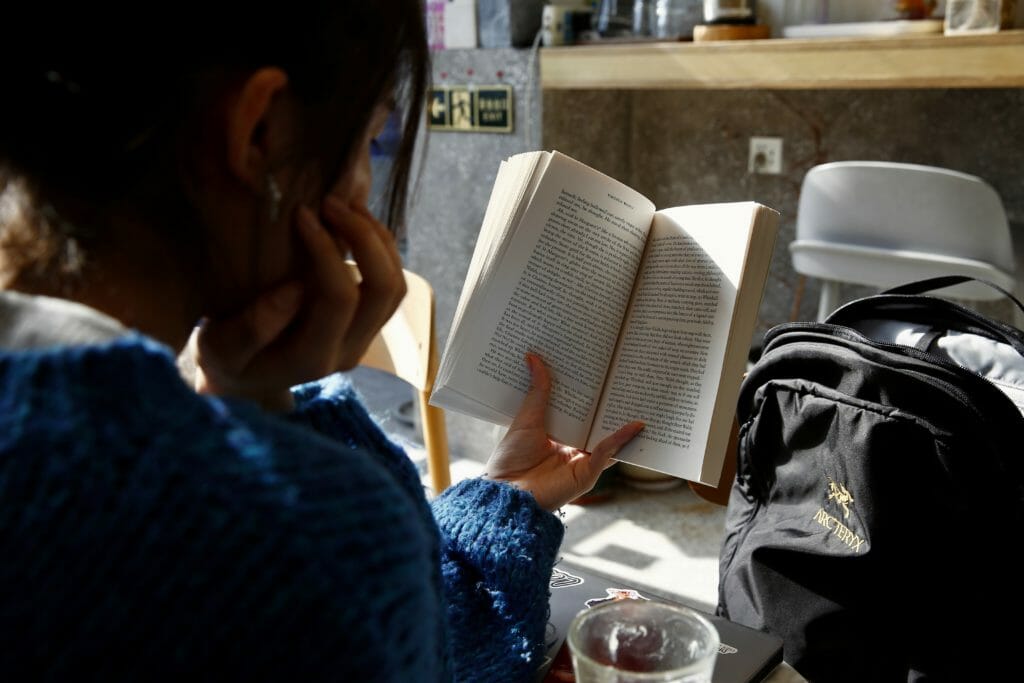 woman reading indie book