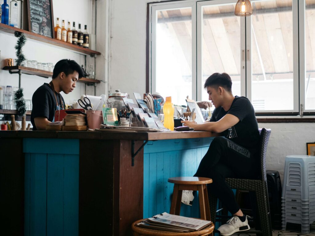Two Men In A Cafe